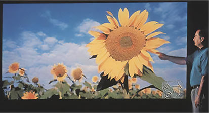 SLM introduces worlds first three color HD laser projection display.